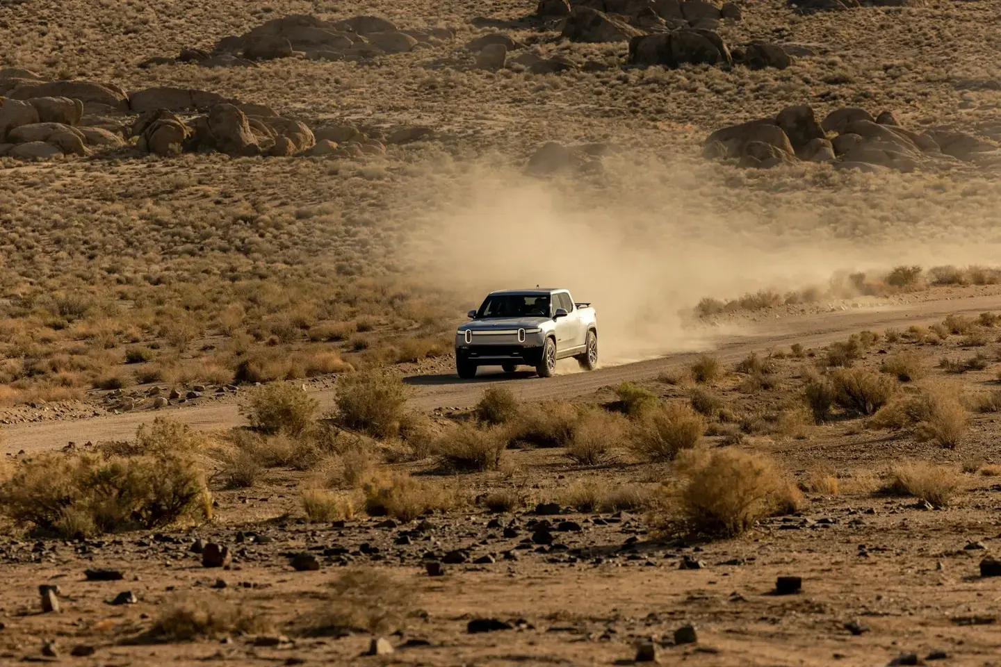 Car driving on an open highway representing how to plan a successful road trip.